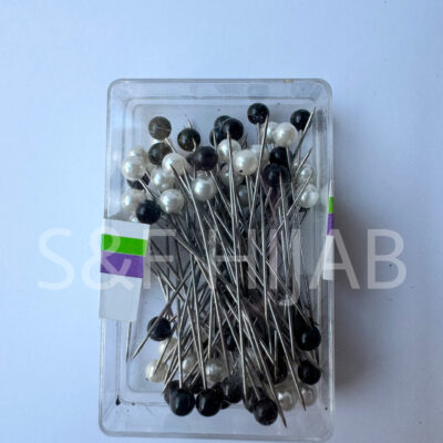 علبة دبابيس أبيض و أسود